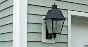 A light on the side of a house.